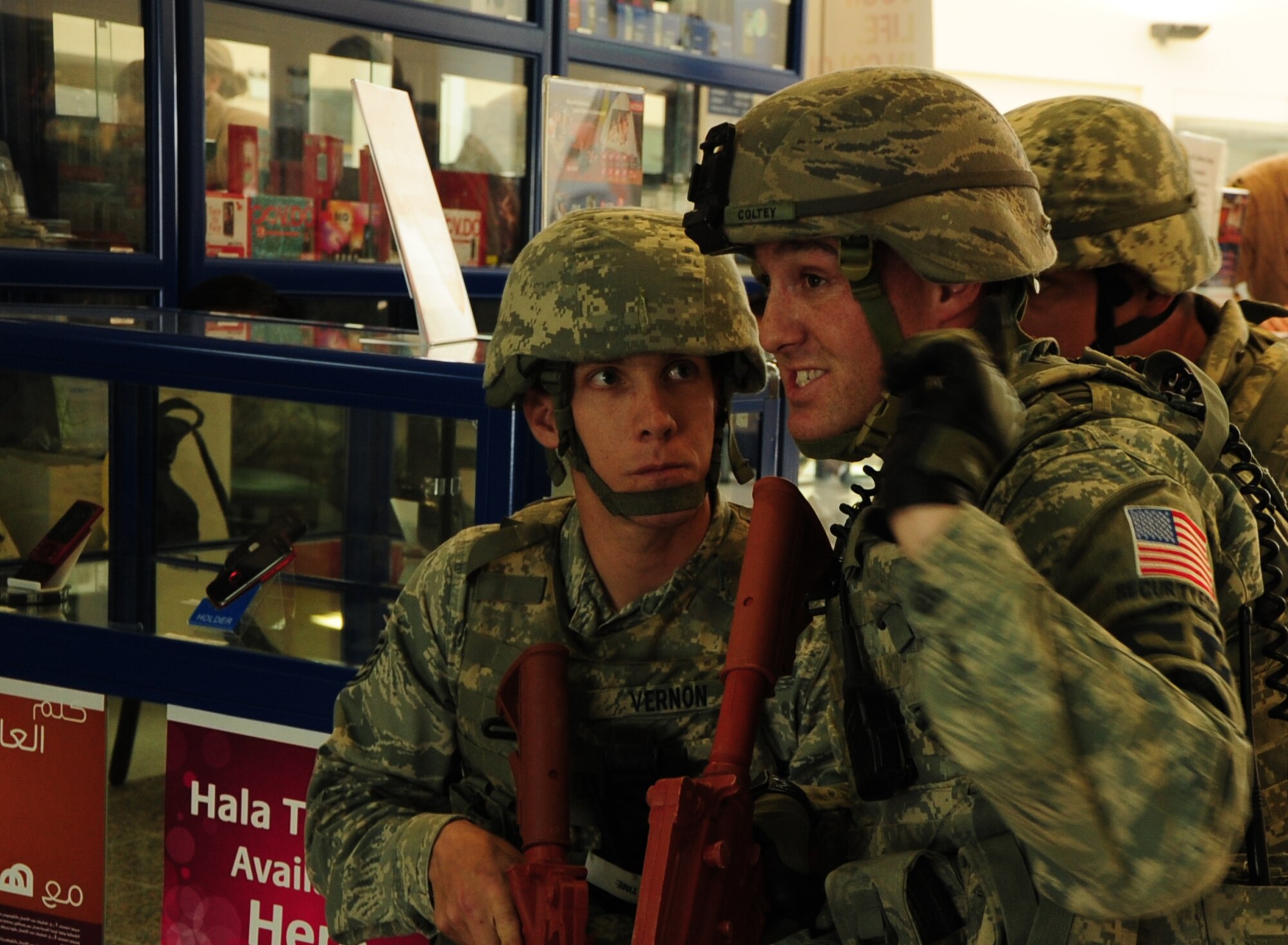 Staff Sgt. Zachary Coltey, 379th Expeditionary Security Forces Squadron ground defense specialist, gives instructions to Staff Sgt. William Vernon, 379 ESFS ground defense specialist, during an active shooter exercise Feb. 14, 2012. The exercise tested the defense and response capabilities of U.S. service members and coalition partners on the installation. (U.S. Air Force photo/Senior Airman Michael Charles)