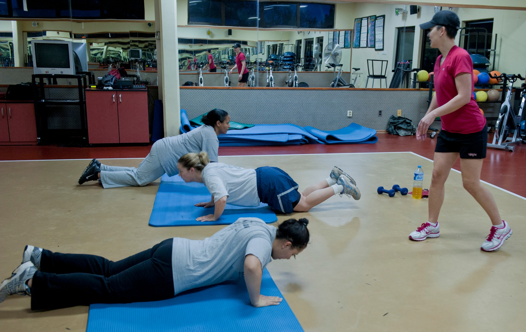 Bobbi Cervantez, Health and Wellness Center exercise physiologist, right, teaches a fitness class designed to help pregnant women stay fit during their pregnancy Feb. 17, 2012, at Incirlik Air Base, Turkey. With more than 20 pregnant active-duty members and several spouses at Incirlik, organized pregnancy PT is a welcome resource. According to Air Force Instruction 10-248, AF Fitness Program, pregnant Airmen are required to participate in physical activity throughout their pregnancy, if cleared by a physician. (U.S. Air Force photo by Senior Airman Anthony Sanchelli/Released)
