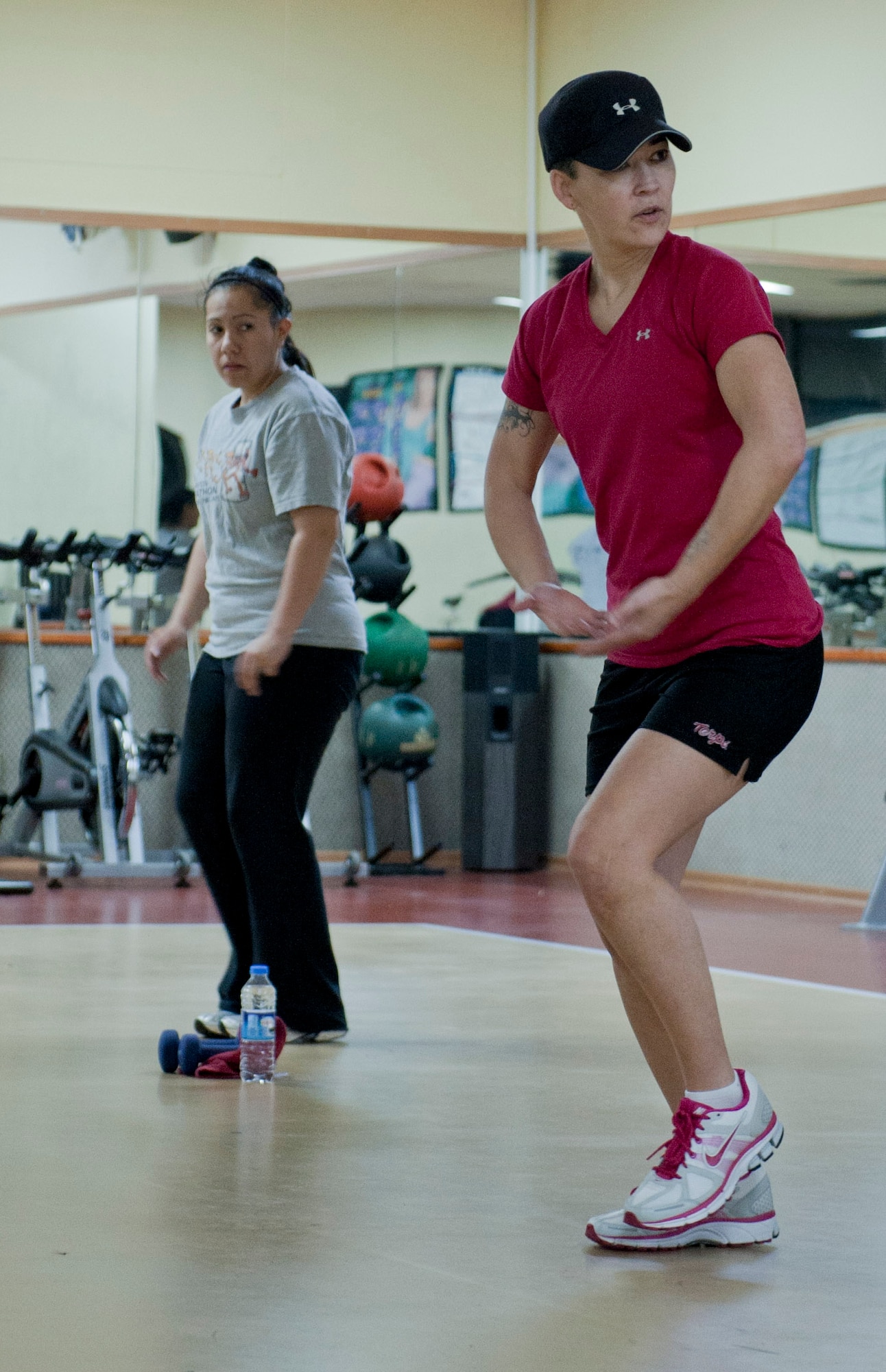 Bobbi Cervantez, Health and Wellness Center exercise physiologist, right, teaches a fitness class designed to help pregnant women stay fit during pregnancy Feb. 17, 2012, at Incirlik Air Base, Turkey. With more than 20 pregnant active-duty members and several spouses at Incirlik, organized pregnancy PT is a welcome resource. According to Air Force Instruction 10-248, AF Fitness Program, pregnant Airmen are required to participate in physical activity throughout their pregnancy, if cleared by a physician. (U.S. Air Force photo by Senior Airman Anthony Sanchelli/Released)