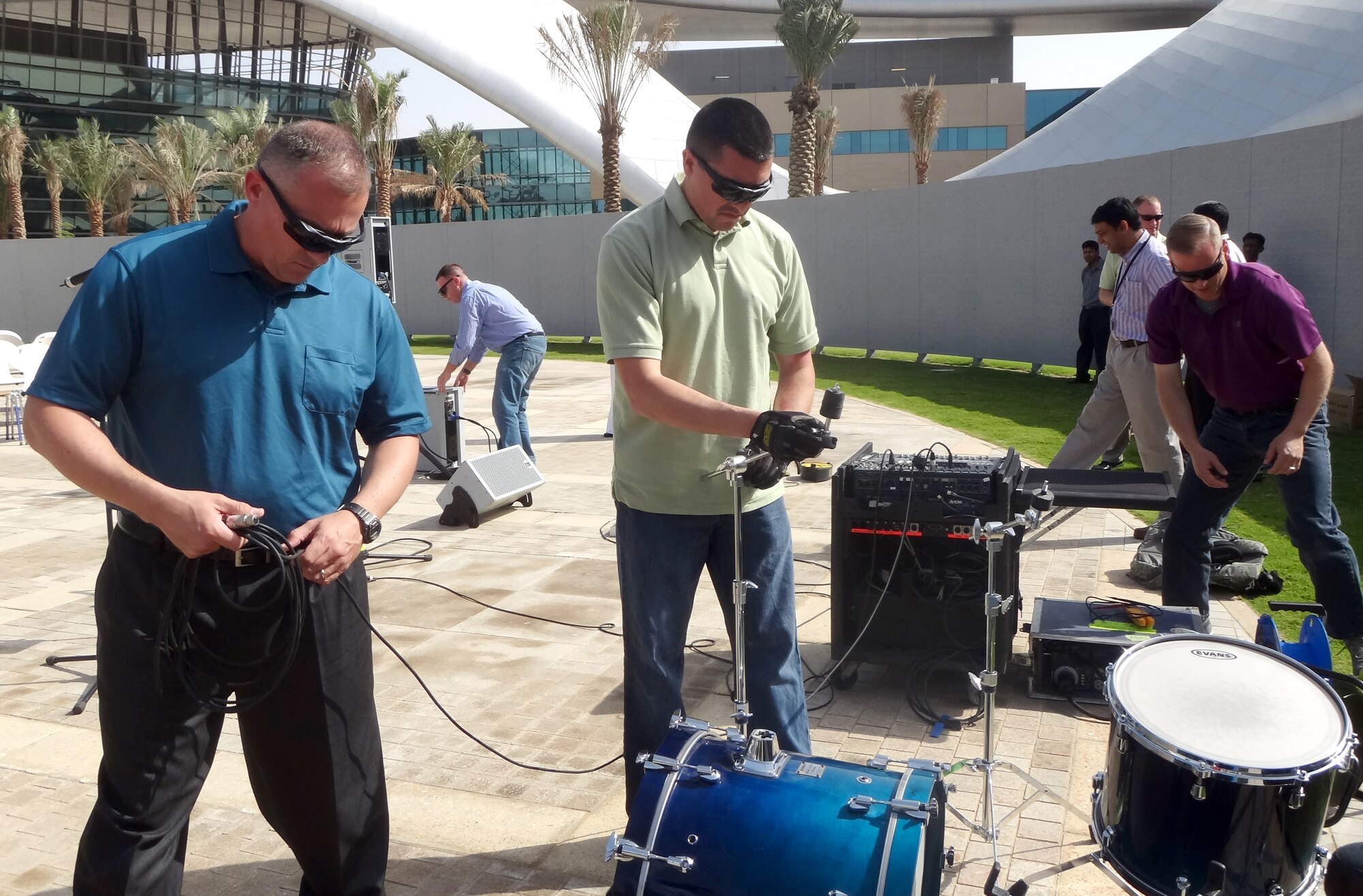 ABU DHABI, United Arab Emirates - U.S. Air Forces Central Band Afterburner sets up band equipment to perform the first-ever rock concert at Zayed University in Abu Dhabi Feb. 16, 2012. The performance was coordinated as part of the continuing diplomacy mission of the U.S. Embassy. The American ambassador to the United Arab Emirates, Michael Corbin, attended the event, as did the Minister of Education, His Excellency Humaid Mohammad Al Qattami. (U.S. Air Force photo/Tech. Sgt. Arian Nead)