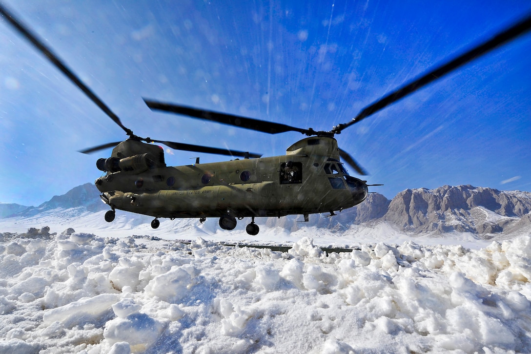 A CH-47 Chinook helicopter kicks up snow at a remote landing zone in the Shah Joy district in Afghanistan's Zabul province, Feb. 8, 2012. Helicopters provide an efficient and reliable means of transporting personnel and cargo to the country's rural areas.