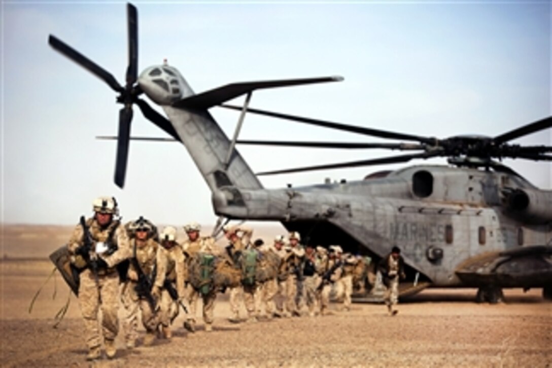 U.S. Marines and Afghan border police off-load from a CH-53D Sea ...