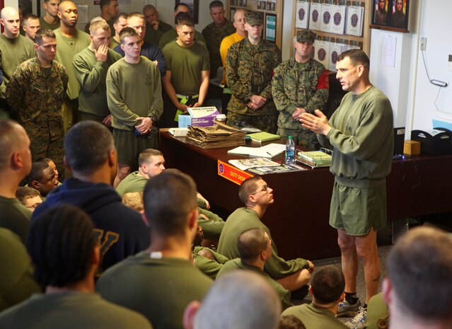 Marines and Sailors with Command Element, 24th Marine Expeditionary Unit, gather around Col. Frank Donovan, 24th MEU commanding officer, after a motivation run at the 24th MEU building aboard Camp Lejeune, N.C., Feb. 17, 2012. The colonel commended the Marines and Sailors for their admirable performance during the 24th MEU’s certification exercise (CERTEX) prior to releasing them for an extended weekend.