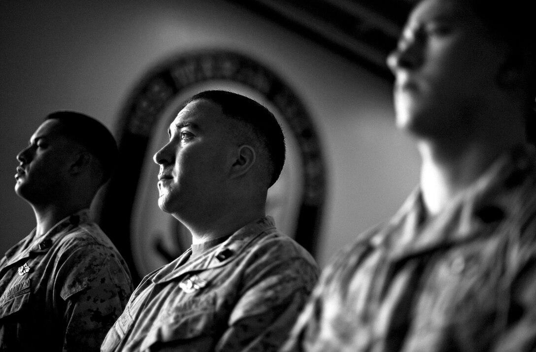 120217-M-GY762-003::r::::n::Petty Officer 3rd Class David C. Elizardo sheds tears at a Feb. 17 memorial service aboard USS Makin Island here honoring fellow hospital corpsman Petty Officer 3rd Class Kyler L. Estrada, who died in a Djibouti training accident Feb. 14. Estrada, who served with Company I, Battalion Landing Team 3/1, was 21 and a native of Maricopa, Ariz. “Doc died in the company of his brothers,” said company commander Capt. Matt McGirr. The landing team is the ground combat element for the 11th Marine Expeditionary Unit, deployed as part of the Makin Island Amphibious Ready Group to the U.S. Fifth Fleet area of responsibility. Elizardo, 28, hails from Madrid.