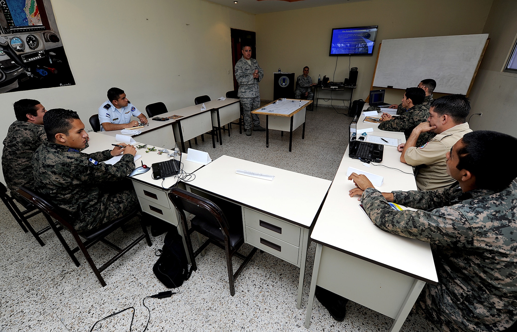 Tech. Sgt. Aaron Carrillo, 571st Mobility Support Advisory Squadron air traffic control air advisor, reviews tower operations during block three portion of the ATC seminar Feb. 13, as part of month-long Building Partner Capacity mission.  The BPC mission is designed to promote regional stability by fostering key relationships and enhancing partner nation capabilities.  (U.S. Air Force photo by Tech. Sgt. Lesley Waters)
