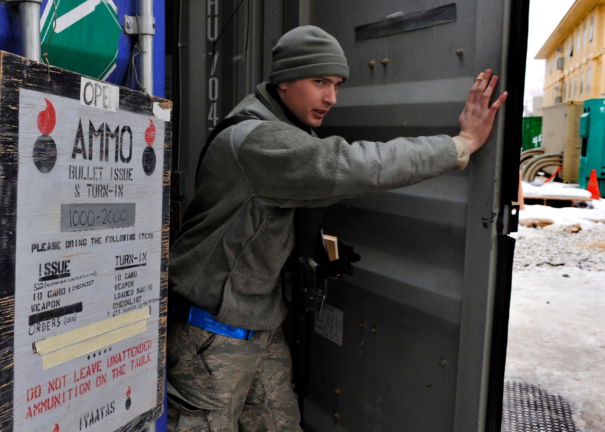 BAGRAM AIRFIELD, Afghanistan— An Airman exits the bullet issue conex at Bagram Airfield, Afghanistan, Feb. 17, 2012. All Airmen on Bagram receive their ammunition from the bullet issue conex within 72 hours of arriving at Bagram. (U.S. Air Force photo/ Airman 1st Class Ericka Engblom) 