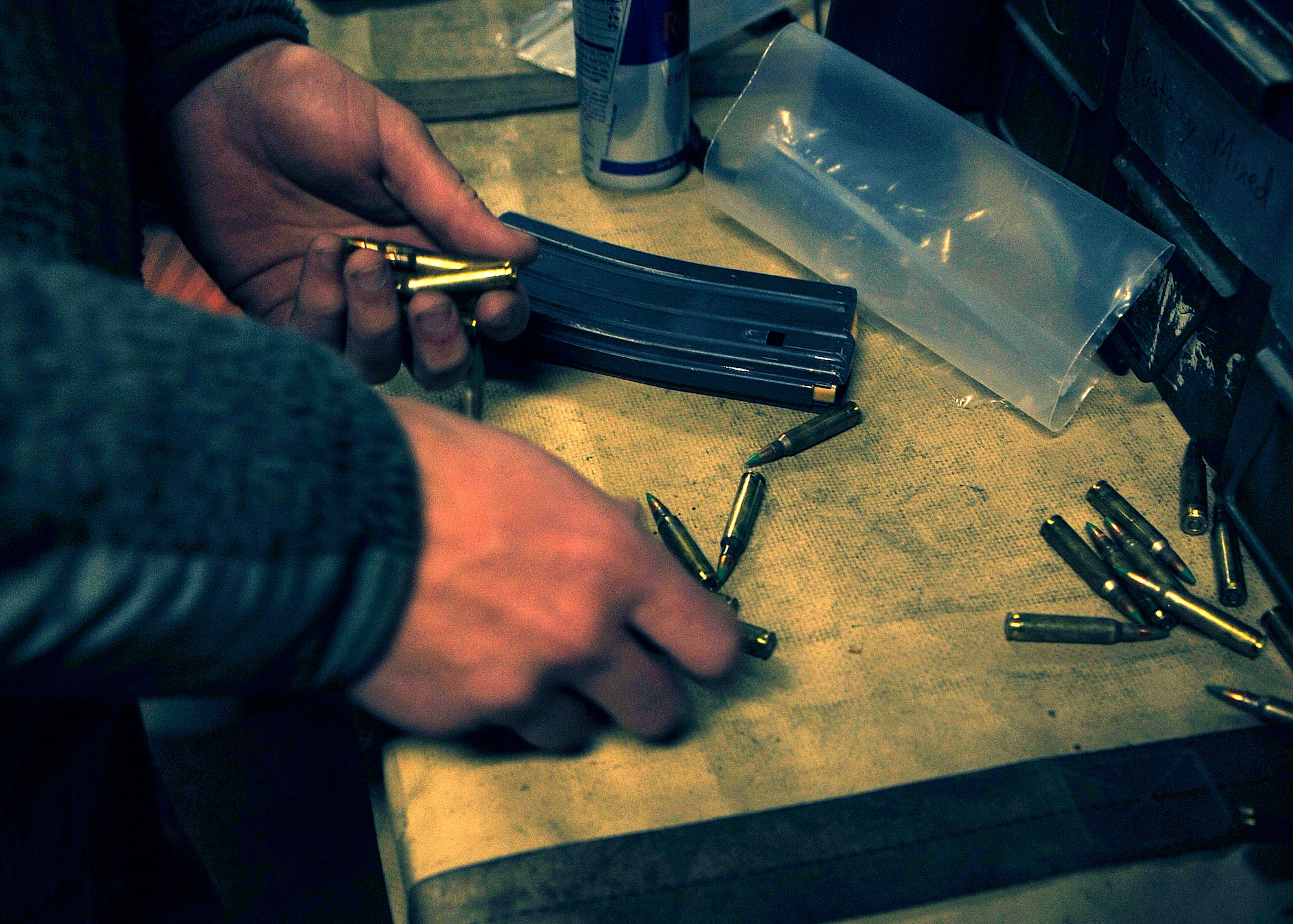 BAGRAM AIRFIELD, Afghanistan— Airman 1st Class Scott Brown unloads M-4 rounds from a magazine at Bagram Airfield, Afghanistan, Feb. 17, 2012. Brown is a bullet issue crew member with the 455th Expeditionary Maintenance Squadron. (U.S. Air Force photo/Airman 1st Class Ericka Engblom)