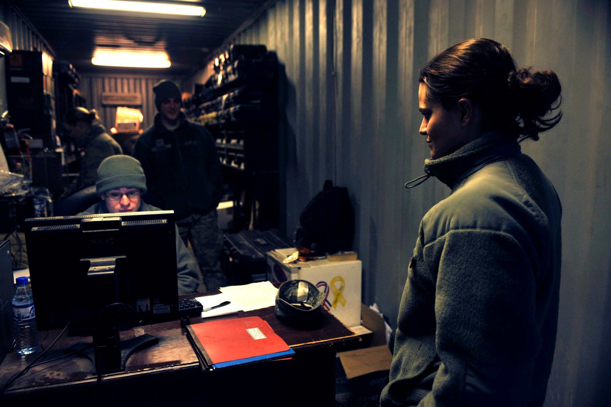 BAGRAM AIRFIELD, Afghanistan— Staff Sgt. Deanna Fischer waits while Staff Sgt. Joshua Kuhnel adds her returned ammunition into the ammunition accountability system at Bagram Airfield, Afghanistan, Feb. 17, 2012. Fischer is a hydraulics craftsman with 455th Expeditionary Maintenance Squadron and Kuhnel is the noncommissioned officer in charge of bullet issue with the 455th Expeditionary Maintenance Squadron. (U.S. Air Force photo/Airman 1st Class Ericka Engblom)