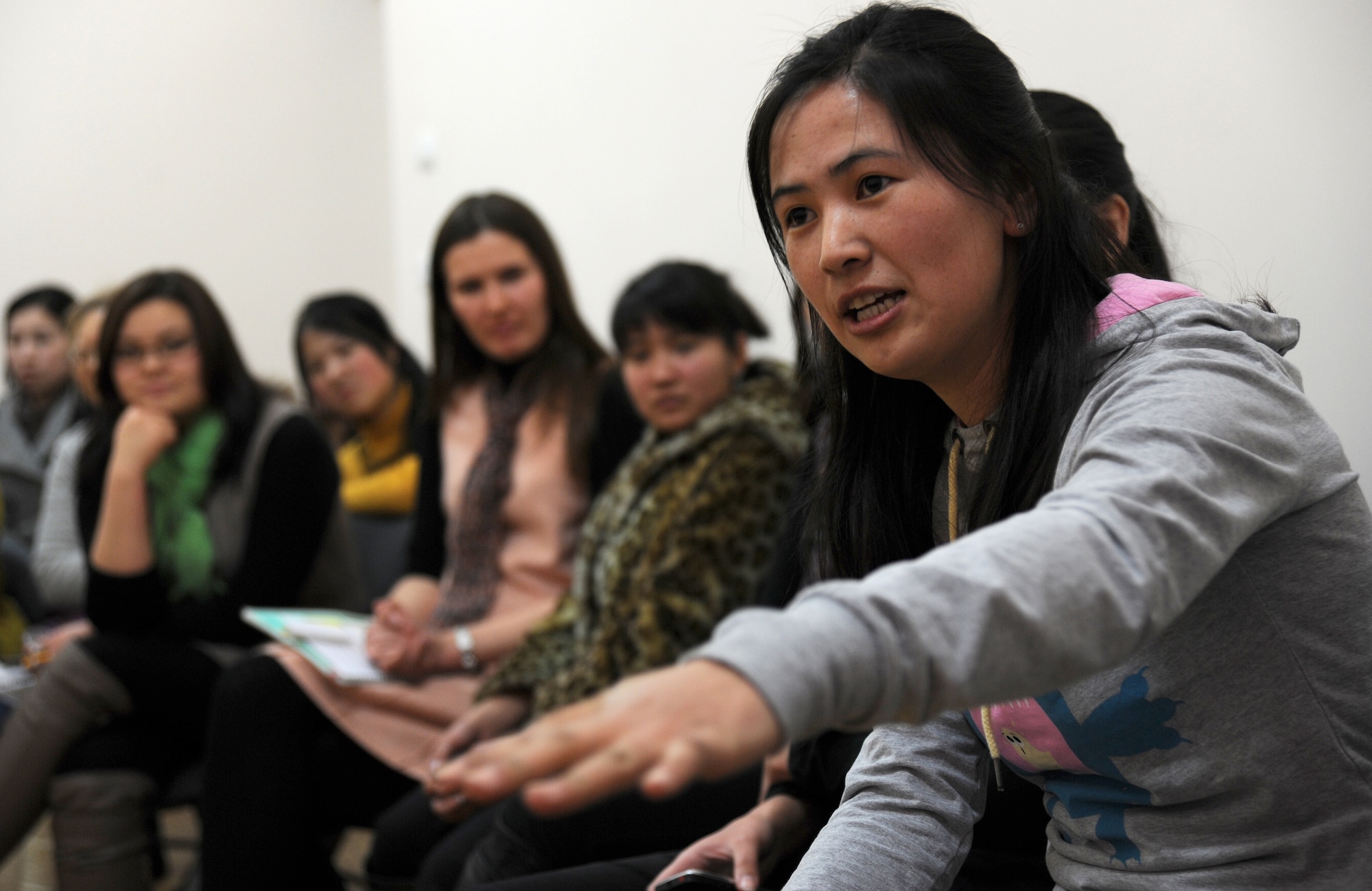 Venera Myrzabaeva, a 22-year-old Kyrgyz Republic university student, explains the cultural pressure on Kyrgyz women to marry by the age of 25 to female Airmen from the Transit Center at Manas during the Women’s Club discussion at the American Corner in Bishkek, Kyrgyzstan, Feb. 17, 2012. More than 30 female students and faculty members attended this week’s cultural exchange. Topics discussed included marriage, children, career goals and life regrets. Venera is studying linguistics at the International University of Kyrgyzstan. (U.S. Air Force photo/Master Sgt. Tracy L. DeMarco) 