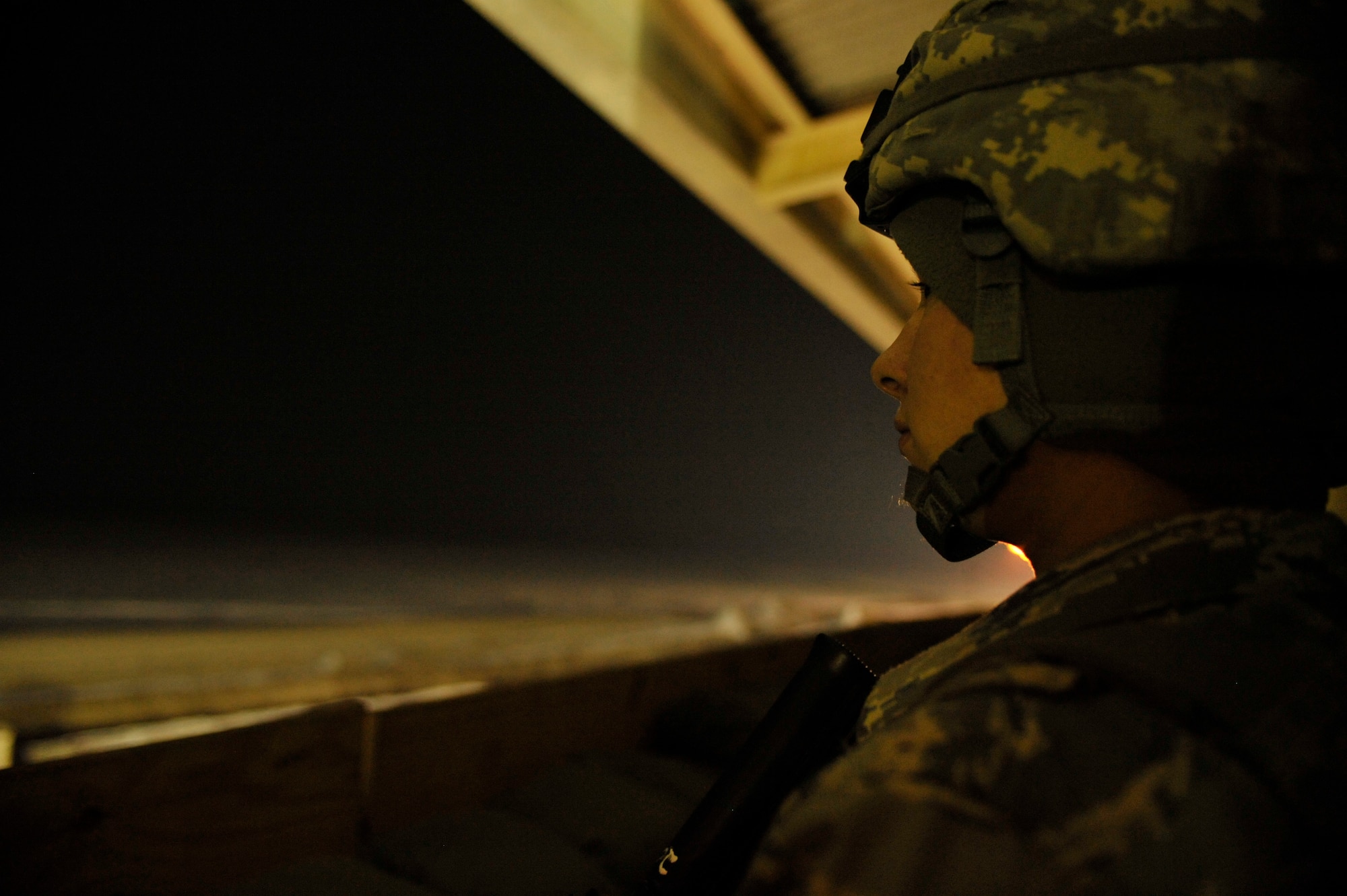 BAGRAM AIRFIELD, Afghanistan—Airman 1st Class Sandra Crawford watches the Bagram Airfield perimeter from Tower 59 at Bagram Airfield, Afghanistan, Feb. 16, 2012. Crawford is a perimeter response team member with the 455th Expeditionary Security Forces Squadron. Perimeter response team members watch Bagram’s perimeter for any potential threats and actively respond to all possible situations. (U.S. Air Force photo/Airman 1st Class Ericka Engblom)