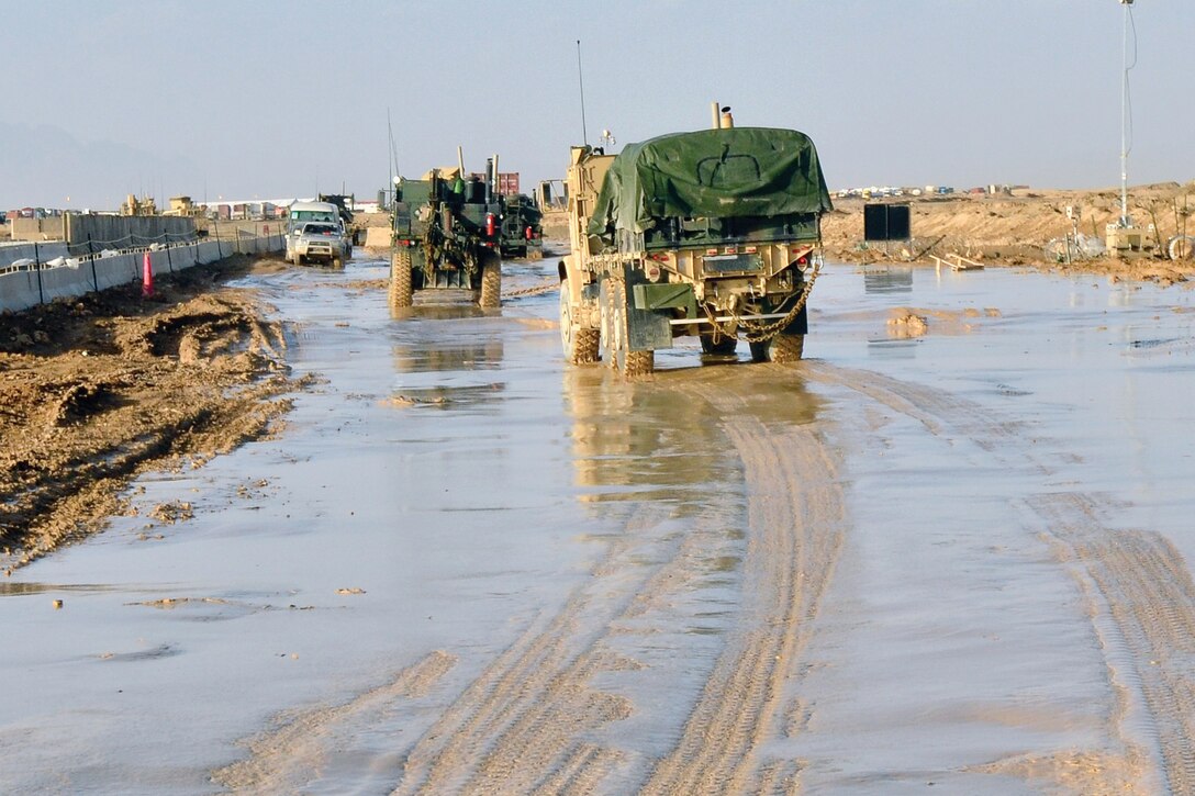 Marines with Combat Logistics Battalion 4 conduct a combat logistics patrol through Helmand province, Afghanistan, Feb. 21. The patrol successfully resupplied forward operating bases in the area despite treacherous road conditions created by inclement weather. The battalion is part of 1st Marine Logistics Group (Forward).