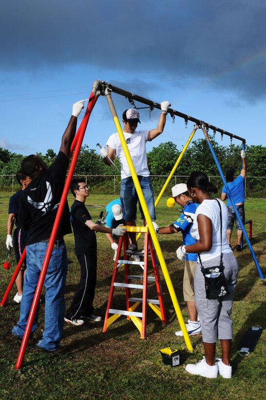 Members of Team Andersen along with members from the Japan Air Self Defense Force and the Royal Australian Air Force participate in a community beautification project in Dededo, Guam, Feb. 18. The community event was part of Cope North 2012 a multinational exercise designed to enhance air operations between the U.S. Air Force, JASDF and the RAAF. (U.S. Air Force photo/Senior Airman Carlin Leslie)