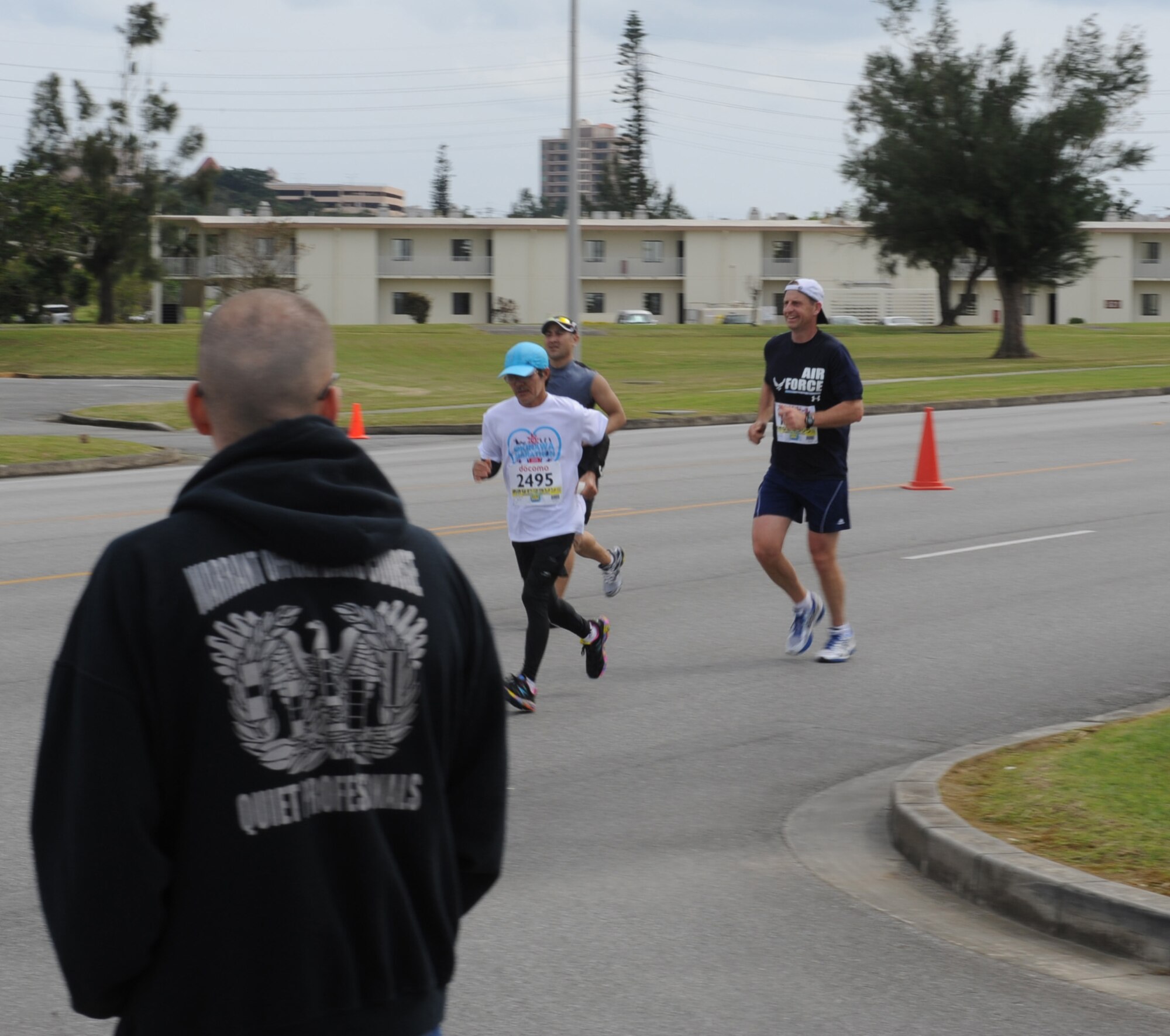 U.S. Air Force Col. Corey Martin, 18th Wing vice commander, and other runners participate in the 2012 Okinawa Marathon on Kadena Air Base, Japan, Feb. 20, 2012. More than 11,000 runners participated in the 2012 Okinawa Marathon, including more than 250 military personnel from bases across the island. (U.S. Air Force photo by Airman 1st Class Justin Veazie/Released) 