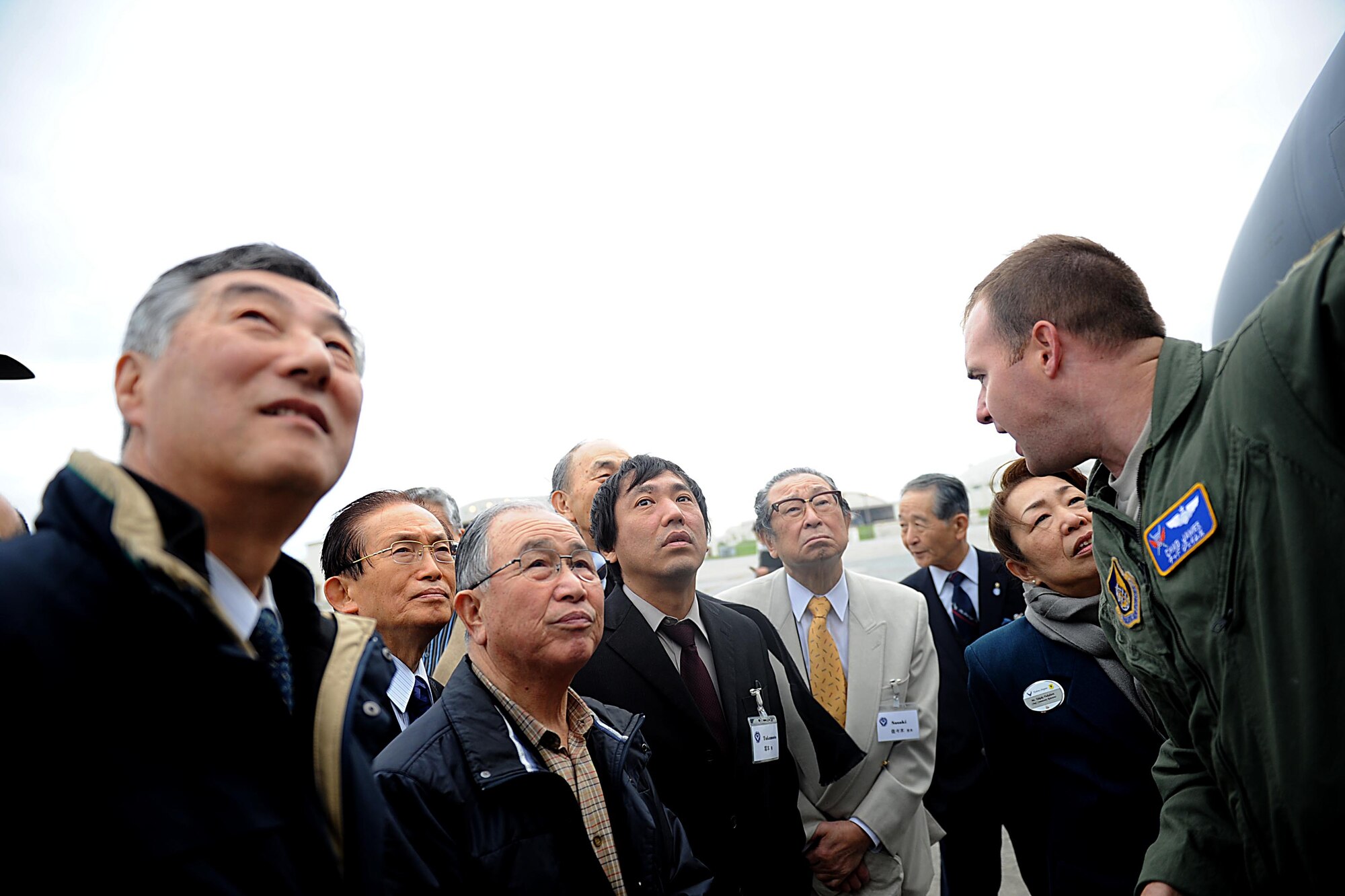U.S. Air Force Maj. Chad James, 18th Operations Support Squadron fighter plans, discusses the U.S. Air Force F-15 Eagle fighter jet with members of the Japan-American Air Force Goodwill Association on Kadena Air Base, Japan, Feb. 17, 2012. JAAGA promotes bilateral friendship and mutual understanding between the Japan Air Self-Defense Forces and the U.S. Air Force. (U.S. Air Force photo by Airman 1st Class Brooke P. Beers/Released)