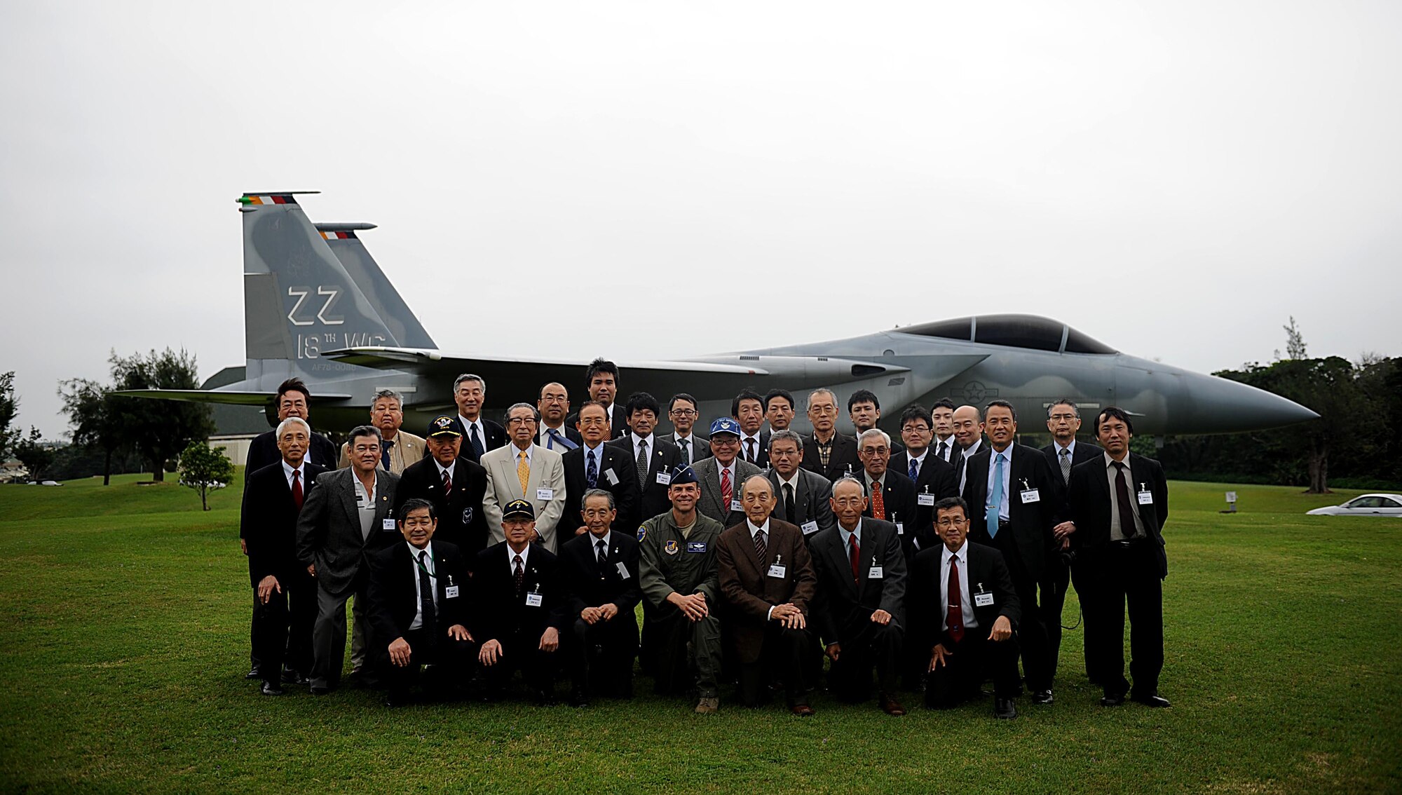 Members of Japan-American Air Force Goodwill Association pose for a group photo with U.S. Air Force Brig. Gen. Matthew Molloy, 18th Wing commander, during a visit to Kadena Air Base, Japan, Feb. 16, 2012. The group consisted of retired Japan Air Self-Defense Forces members, cooperative associate members and other individuals. (U.S. Air Force photo by Airman 1st Class Brooke P. Beers/Released)