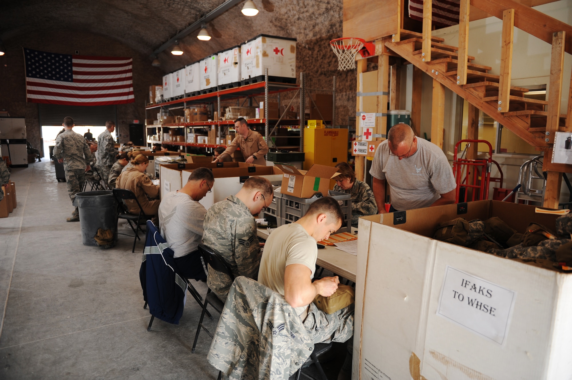 SOUTHWEST ASIA – Volunteers replace components in individual first aid kits here Feb. 14, 2012. All items in an IFAK must have at least one year left until expiration or the item must be replaced. (U.S. Air Force photo/Staff Sgt. Nathanael Callon)