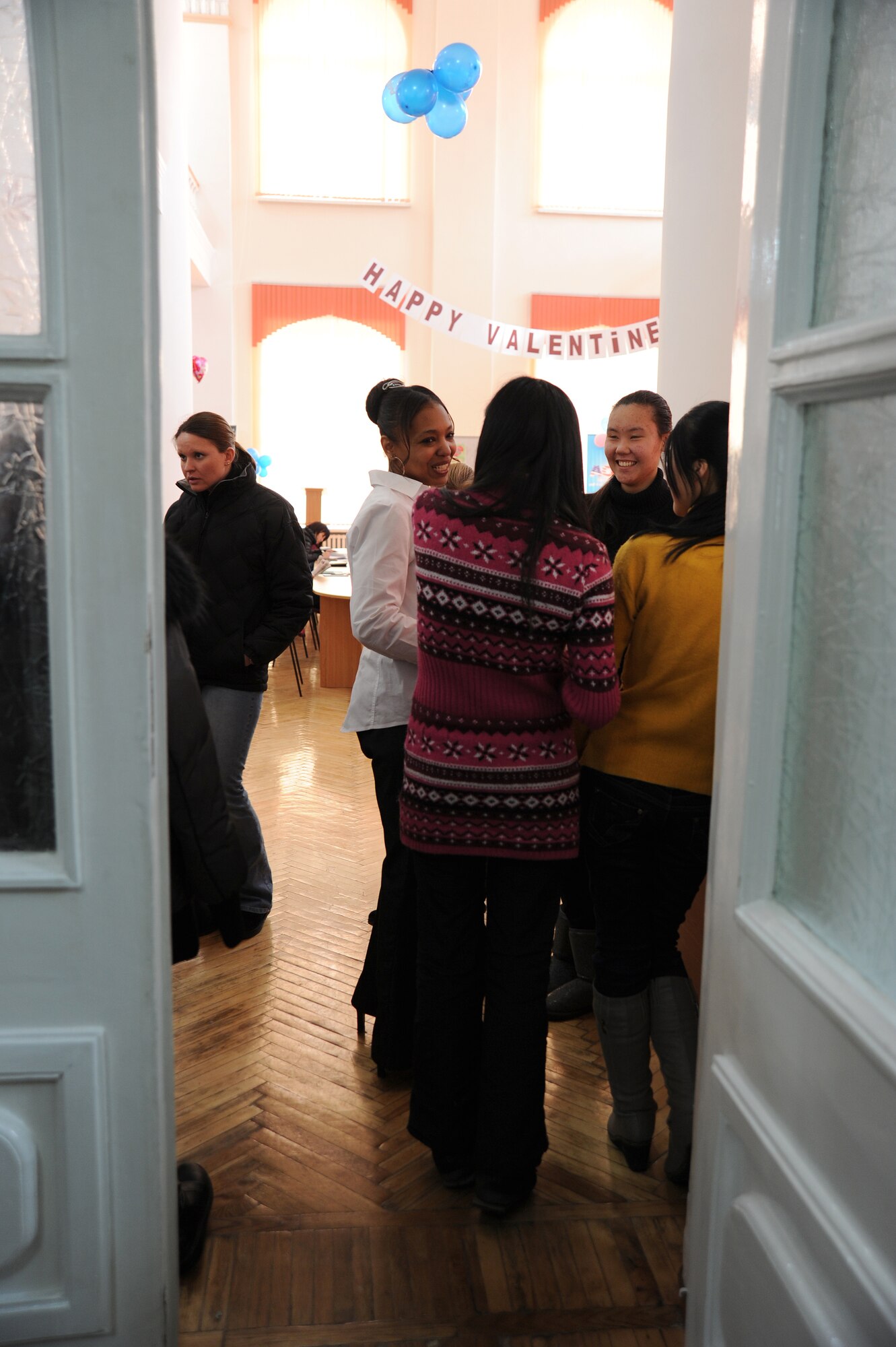 Female Airmen from the Transit Center at Manas visit with female Kyrgyz Republic university students and faculty at the Bayalinov Children's Library during Women's Club, a part of the U.S. Embassy-sponsored American Corner, Feb. 17, 2012. More than 30 women attended this week's cultural exchange. The women chatted about marriage, children, career goals and life regrets. Most of the women have attended other Women's Club discussions, but for a few of the young Kyrgyz students this was their first time speaking with Americans from the TCM. (U.S. Air Force photo/Master Sgt. Tracy L. DeMarco)