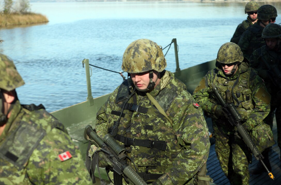 Canadian national guardsmen make their way to shore during a training exercise with Bridge Company, 8th Engineer Support Battalion, 2nd Marine Logistics Group at Engineer’s Point aboard Camp Lejeune, N.C., Jan. 6, 2012. Throughout the exercise, the Canadians operated watercraft, manned safety boats and provided security for the scenarios. (U.S. Marine Corps photo by Pfc. Franklin E. Mercado)