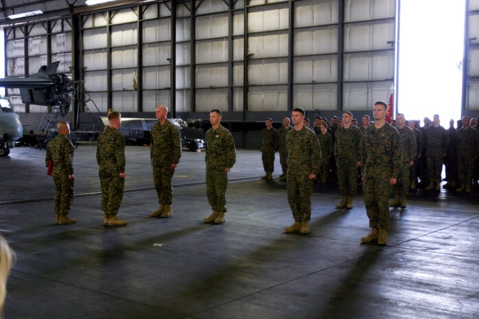 Marines from Marine Medium Tiltrotor Squadron 264 were awarded the Air Medal for heroic actions in support of Operation Enduring Freedom, Dec. 16. (From left to right) Capt. Thomas M. Keech, the mission pilot, Capt. Matthew A. Cave, the mission co-pilot, Sgt. Justin K. Bartfield-Smith, the mission aerial gunner and observer, and Cpl. John M. Cederholm, the mission crew chief, were awarded for actions during a priority re-supply mission in support of 1st Battalion, 5th Marine Regiment, in the Sangin River Valley, Afghanistan, June, 12. This mission was the first time an MV-22B had engaged an enemy in combat.