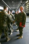 Marines from Marine Medium Tiltrotor Squadron 264 congratulate (From right to left) Capt. Thomas M. Keech, pilot, Capt. Matthew A. Cave, co-pilot, Sgt. Justin K. Bartfield-Smith, aerial gunner and observer, and Cpl. John M. Cederholm, crew chief, after they were awarded the Air Medal, Dec. 16. The award was presented for the crew’s conduct during a priority re-supply mission in support of 1st Battalion, 5th Marine Regiment, in the Sangin River Valley, Afghanistan, June, 12. This mission was the first time an MV-22B had engaged an enemy in Afghanistan.