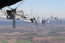 Marines from Marine Medium Tiltrotor Squadron 365 fly 8 MV-22B Ospreys in an echelon right formation on their way back to Marine Corps Air Station New River, Dec. 29. These eight Ospreys were some of the last aircraft to be tested out before the squadron goes on their deployment to Afghanistan.
