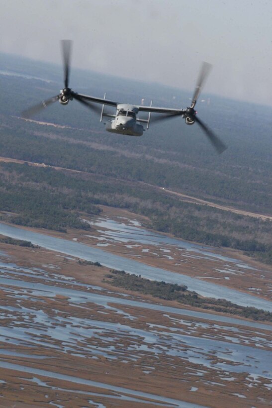 Marines from Marine Medium Tiltrotor Squadron 365 fly an MV-22B Osprey from Marine Corps Air Station New River toward Wilmington N.C. This was part of the squadron’s last flight before their deployment in early January and their last flight of 2011, Dec. 29.
