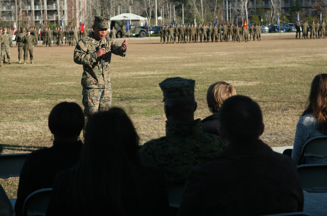 Lt. Col. Ferdinand F. Llantero, the new commanding officer for 8th Engineer Support Battalion, 2nd Marine Logistics Group, speaks with guests during a change of command ceremony at Soifert Field aboard Camp Lejeune, N.C., Dec. 29, 2011. During the ceremony, Lt. Col. Christopher G. Downs relinquished his authority of the unit to Llantero. (U.S. Marine Corps photo by Pfc. Franklin E. Mercado)