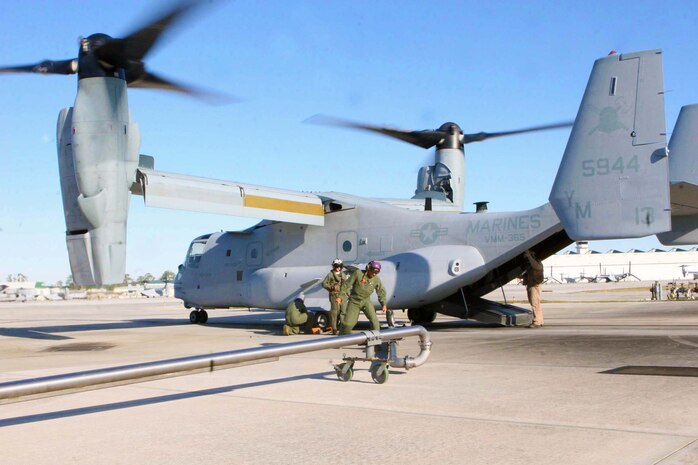 Marines From Marine Medium Tiltrotor Squadron 365 refuel before their last flight before their deployment early January, and their last flight of the year, Dec. 29. The flight consisted of 28 Marines flying eight MV-22B Ospreys in designated formations to a landing zone and back. 