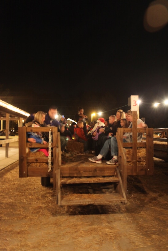 MARINE CORPS BASE CAMP LEJEUNE, N.C. -Participants await the begining of the Holiday Lights and Hayride event at Mike's Farm. The tour included numerous families out for a night of fun.  (Official U.S. Marine Corps Photo by Pfc. Jackeline M. Perez Rivera)