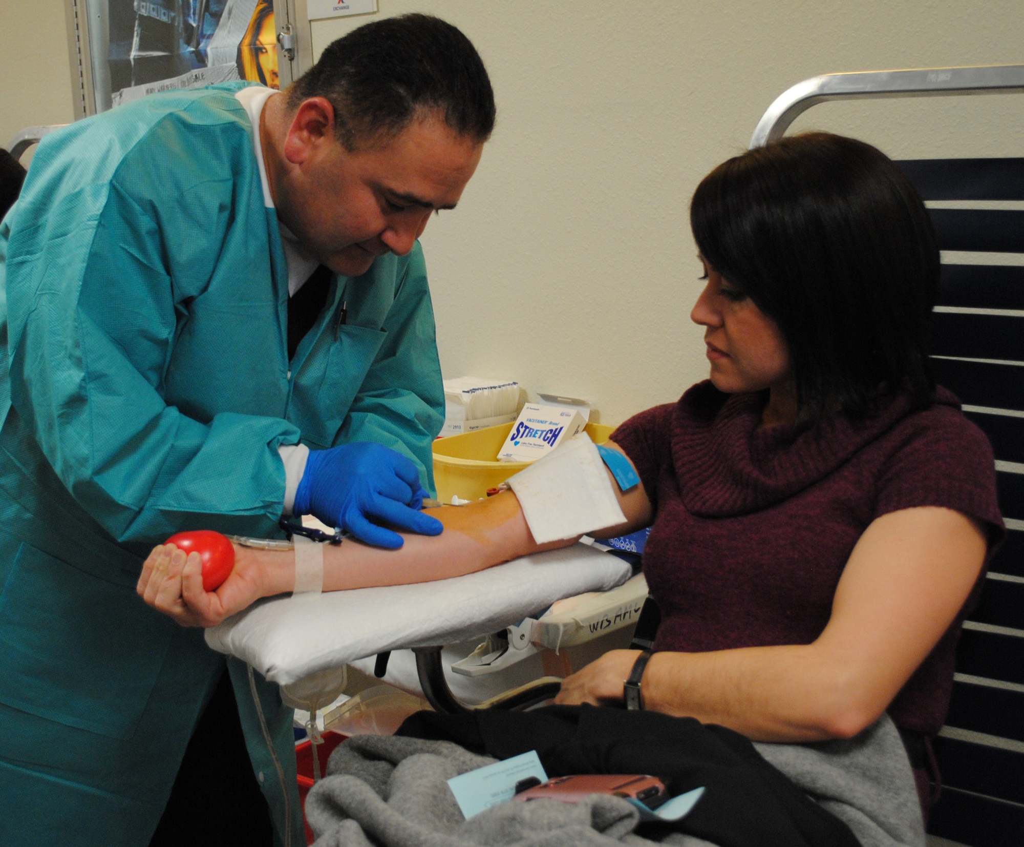 KIRTLAND AFB, N.M. – Jeff Rodriguez, Armed Services Blood Program technician, draws blood from Vanessa Marratt, Air Force Research Laboratory, during the ASBP blood drive Feb. 15 at the base theater. (Photo by Jonathan Rejent)