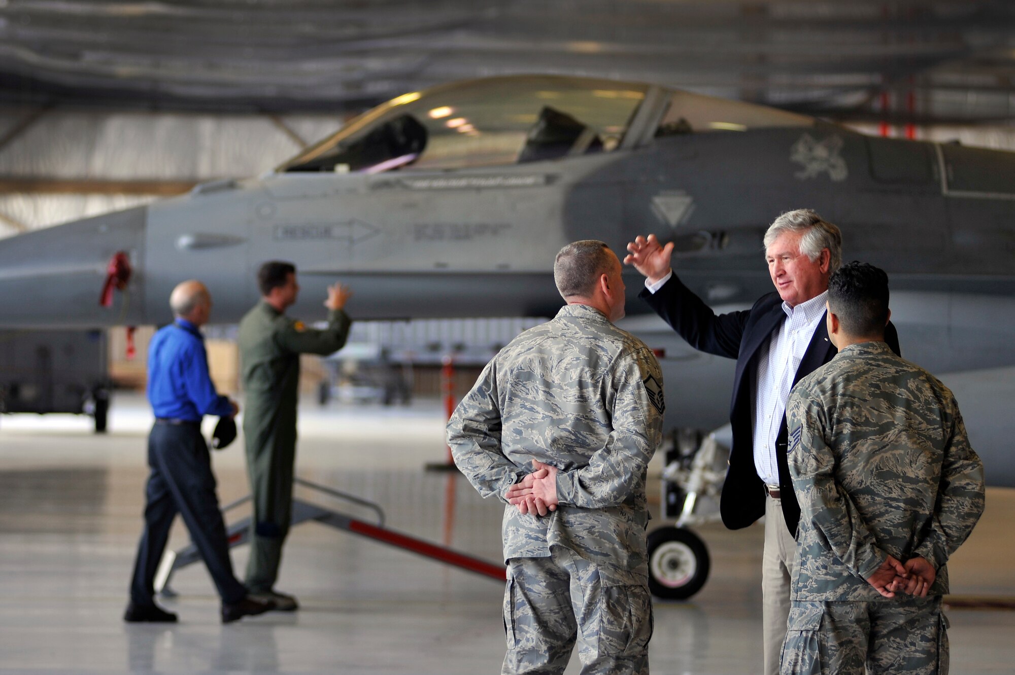 U.S. Army Col. (ret.) Charles Moore, Sr. and Col. Charlie Moore, 20th Fighter Wing commander, use the same hand gestures as they share they talk, Feb. 7, 2012. Moore, Sr. recently visited Shaw to congratulate his son for his recent selection for promotion to the rank of brigadier general. During his visit, he was afforded the opportunity to witness Shaw's mission first hand. (U.S. Air Force photo by Senior Airman Kenny Holston/Released)   


