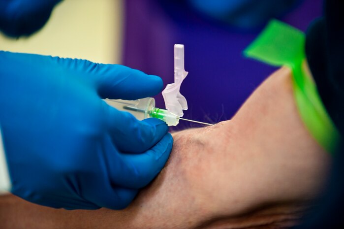 Airman 1st Class Luke Hally, aerospace medical technician, 99th Medical Support Squadron, draws blood from a patient Feb. 17th, 2012, inside the Mike O'Callaghan Federal Medical Center, Nellis Air Force Base, Nev. The 99th MDSS medical laboratory is responsible for a wide variety of tasks utilizing six working sections to analyze, confirm and test different medical samples. Their analysis aids in the diagnosis and treatment of patients. (U.S. Air Force photo by Senior Airman Brett Clashman)