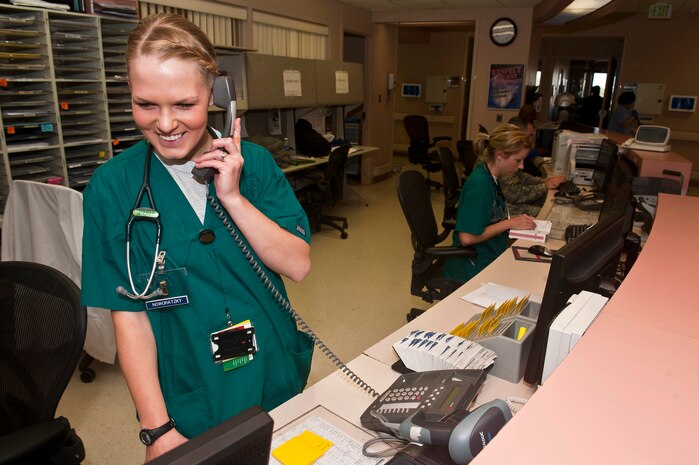 2nd Lt. Amy Noworatzky, clinical nurse, 99th Inpatient Squadron, speaks to a patient on the phone to begin inpatient processing Feb. 21st, 2012 at the Mike O'Callaghan Federal Medical Center, Nellis Air Force Base, Nev. Noworatzky was one of three outstanding performers coined by the Inspector General team during the Health Services Inspection Feb. 17th. (U.S. Air Force photo by Senior Airman Brett Clashman)