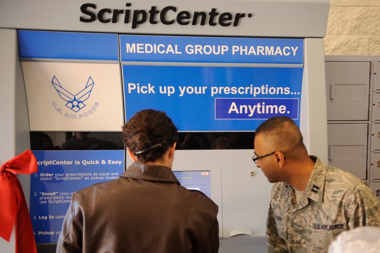 VANDENBERG AIR FORCE BASE, Calif. -- Capt. Anoop Joseph, 30th Medical Group pharmacist, shows Col. Nina Armagno, 30th Space Wing commander, how to use  a Script Center kiosk at the base exchange here Feb. 17, 2012. The kiosk provides customers the ability to pick up prescriptions after normal duty hours. (U.S. Air Force photo/Staff Sgt. Andrew Satran) 

 