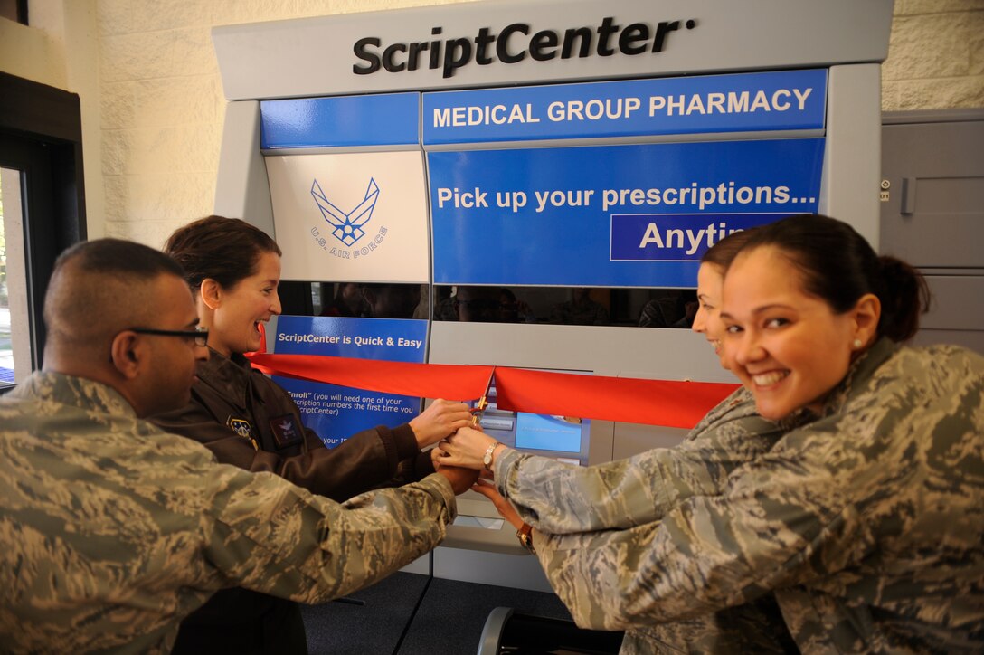 VANDENBERG AIR FORCE BASE, Calif. -- Col. Nina Armagno, 30th Space Wing commander, and 30th Medical Group personnel cut the ribbon for a Script Center kiosk at the base exchange here Feb. 17, 2012. The kiosk allows customers to pick up prescriptions after normal pharmacy hours.   (U.S. Air Force photo/Staff Sgt. Andrew Satran) 

 