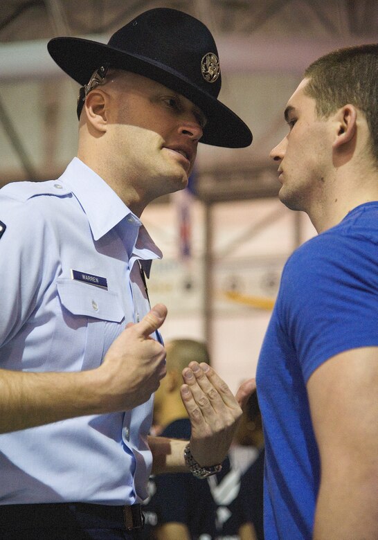 Master Sgt. Brent Warren inspects a member of the Delayed Entry Program Feb. 17, 2012, at the Dover Air Force Base, Del., Air Mobility Command Museum. (U.S. Air Force photos by Airman 1st Class Samuel Taylor)