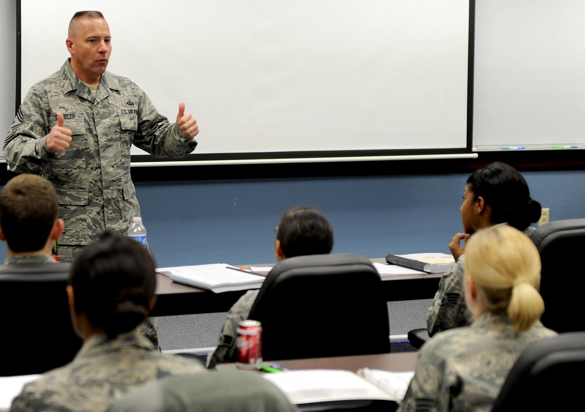 Chief Master Sgt. Kevin Candler, 375th Air Mobility Wing command chief, speaks to the Airman Leadership School class Feb. 21 at Scott Air Force Base, Ill.  Candler encouraged the ALS class to be the best NCO's and supervisors possible.  He also encouraged them not be afraid to enforce Air Force regulation no matter the rank of that individual. (U.S. Air Force photo/Airman 1st Class Divine Cox)