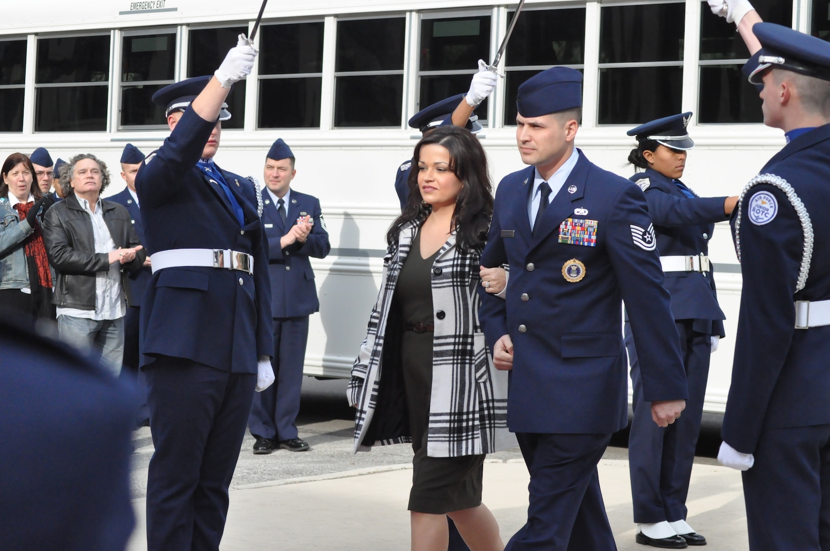 Tech. Sgt. Victor Follis, 364th Recruiting Squadron recruiter, and his wife, Jillian, arrive at Headquarters Air Force Recruiting Service during an Operation Blue Suit ceremony here Feb. 8. Each year Operation Blue Suit recognizes top Air Force recruiters worldwide. Winners are nominated by their recruiting groups and selected based on their performance in meeting assigned recruiting goals, leadership qualities and other professional traits. This year 15 members of AFRS were recognized as tops in their field. (U.S. Air Force photo/Christa D’Andrea)
