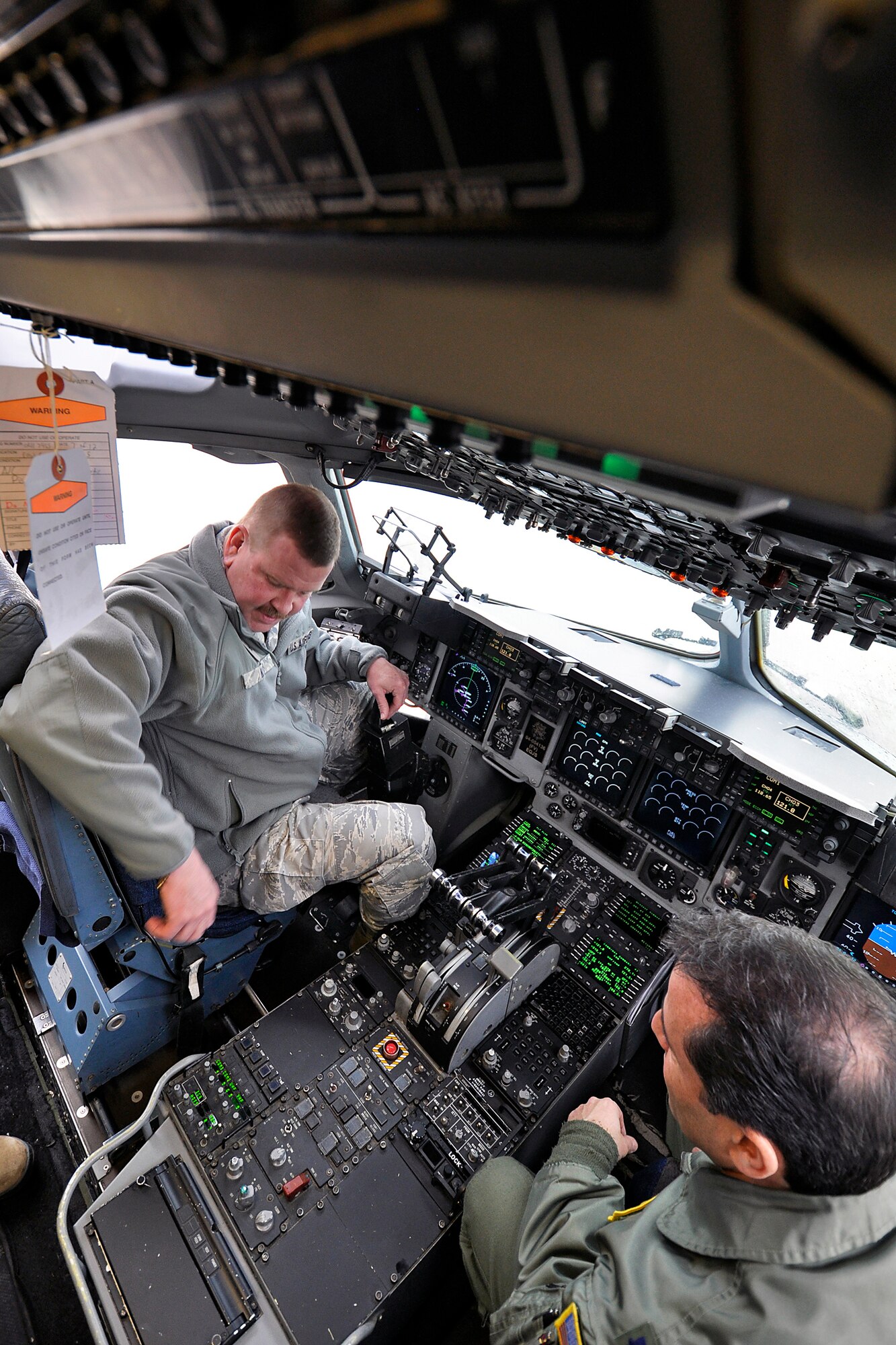 Lt. Col. Ciro Attardo, 732nd Airlift Squadron, describes the features of a C-17 Globemaster III to Brig. Gen. Mark Kyle (left), 4th Air Force commander, on the flightline here Feb. 10. General Kyle was visiting the Freedom Wing as part of his tour of the several wings that moved to the 4th Air Force Oct. 1. (US. Air Force photo by Shawn J. Jones)