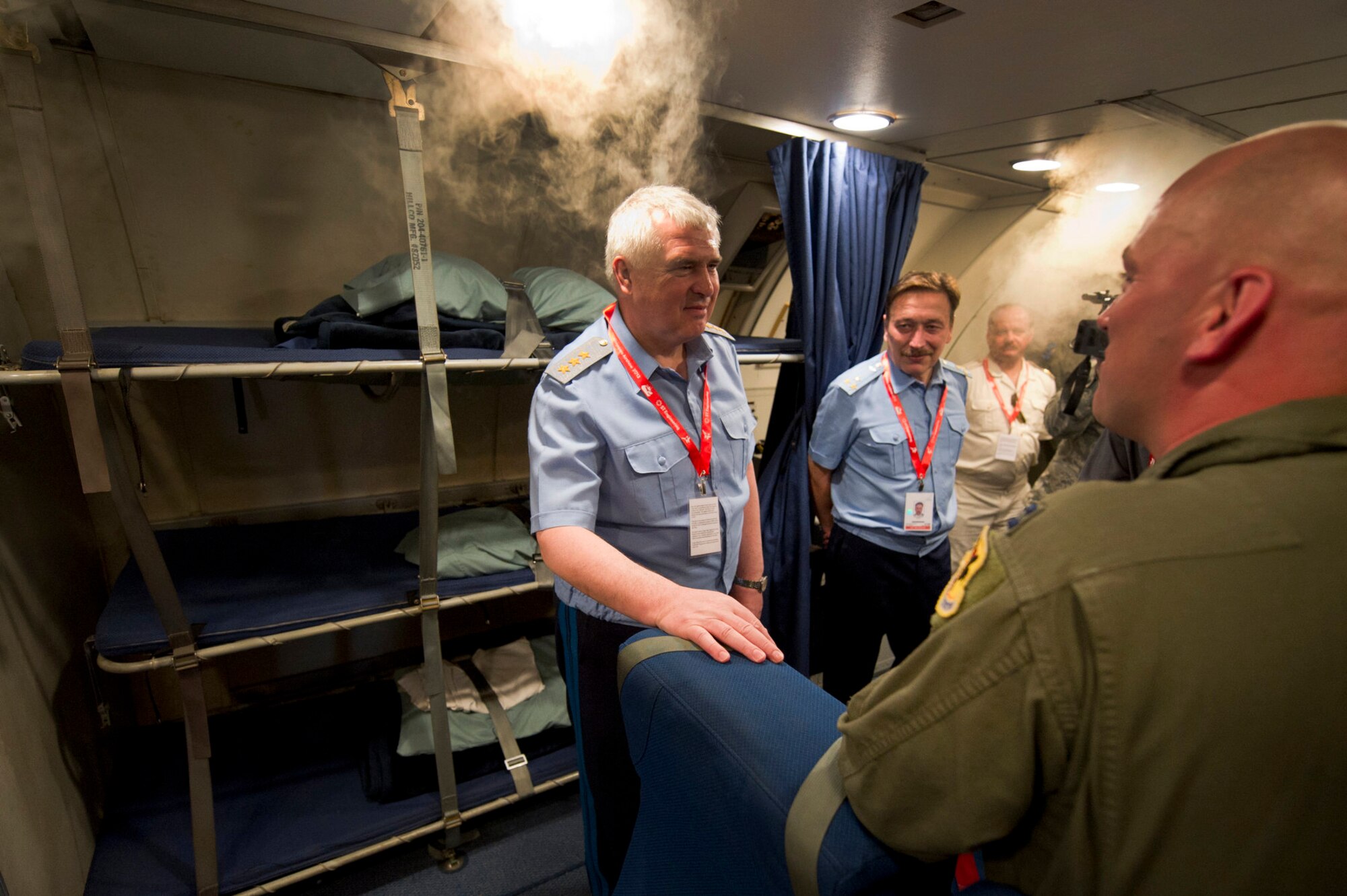 CHANGI, Singapore -- (far right)U.S. Air Force Capt. Joshua Craymer, Aircraft Commander pilot, give a briefing to (left) the Commander in Chief of the Russian Air Force Col. Gen. Alexander Zelin while giving him a tour of a U.S. Air Force E-3 Sentry on Feb. 15, 2012, at the 2012 Singapore Airshow. The biennial Singapore Airshow, while being the third largest trade show in the world also provides the opportunity for Airmen from many different countries to interact and improve foreign relations. (Department of Defense photo by U.S. Air Force Tech. Sgt. Michael R. Holzworth/Released)