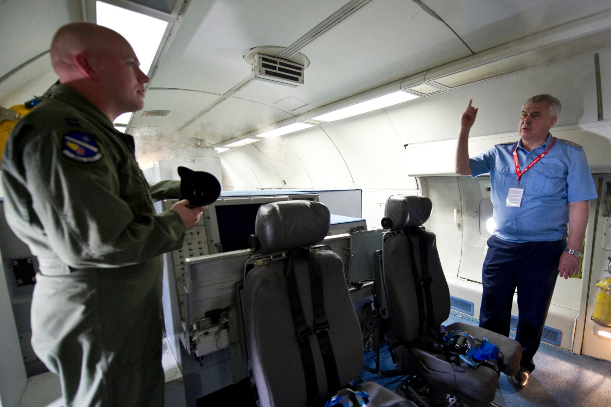 CHANGI, Singapore -- U.S. Air Force Capt. Joshua Craymer, Aircraft Commander pilot, give a briefing to the Commander in Chief of the Russian Air Force Col. Gen. Alexander Zelin while giving him a tour of a U.S. Air Force E-3 Sentry on Feb. 15, 2012, at the 2012 Singapore Airshow. The biennial Singapore Airshow, while being the third largest trade show in the world also provides the opportunity for Airmen from many different countries to interact and improve foreign relations. (Department of Defense photo by U.S. Air Force Tech. Sgt. Michael R. Holzworth/Released)