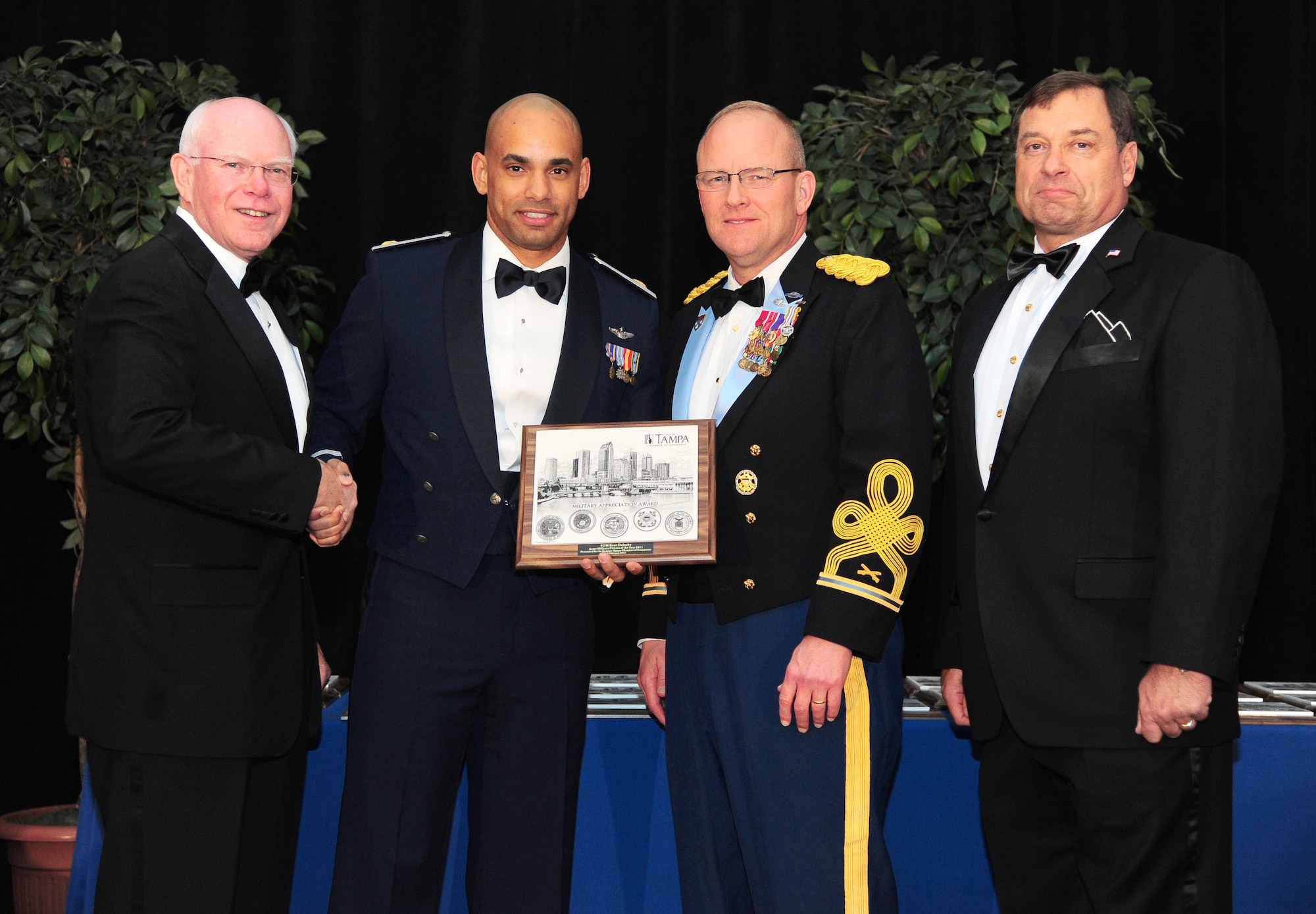 Tampa, Fla. -- Major Brandon Acosta, assistant flight commander with the 63rd Air Refueling Squadron, was recognized as the 927th Air Refueling Wing Military Citizen of the Year.  The award was presented by Col. David Southerland, special assistant to the chairman of the Joint Chiefs of Staff, during a ceremony in downtown Tampa.  (Official U.S. Air Force photo by Airman David Tracy)