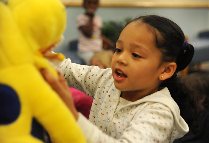 Ariel Brown practices proper brushing techniques on Dudley, the preventative dentistry mascot at the Child Development Center at Joint Base Charleston - Air Base Feb. 10. Every Februrary, the American Dental Association sponsors National Children's Dental Health Month to raise awareness of the importance of children's oral health. Ariel is the daughter of Tech. Sgt. Ricky Brown and Staff Sgt. Crystal Brown. (U.S. Air Force photo / Airman 1st Class Ashlee Galloway)