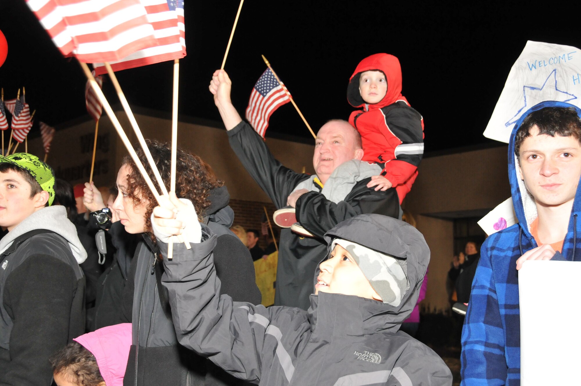 Family and friends give an enthusiastic welcome-home reception to members of the 103rd Civil Engineer Squadron after returning from Afghanistan to Bradley Air National Guard Base, East Granby, Conn., Feb. 20, 2012. The Connecticut Guardsmen had been deployed since July 2011. (U.S. Air Force photo by Tech. Sgt. Erin McNamara\RELEASED)