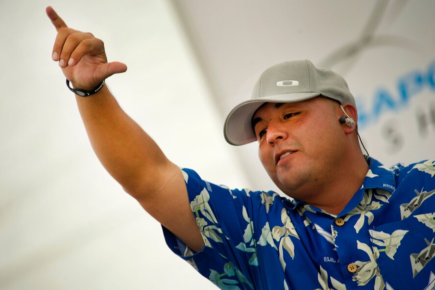 CHANGI, Singapore -- U.S. Air Force Tech. Sgt. Richard Vasquez, U.S. Air Force Band of the Pacific, Hawaii shows the hawaiian shaka sign during a performance on Feb. 17, 2012, at the 2012 Singapore Airshow. The band provided entertainment during the week long Singapore trade and air show performing 13 times. (Department of Defense photo by U.S. Air Force Tech. Sgt. Michael R. Holzworth/Released)