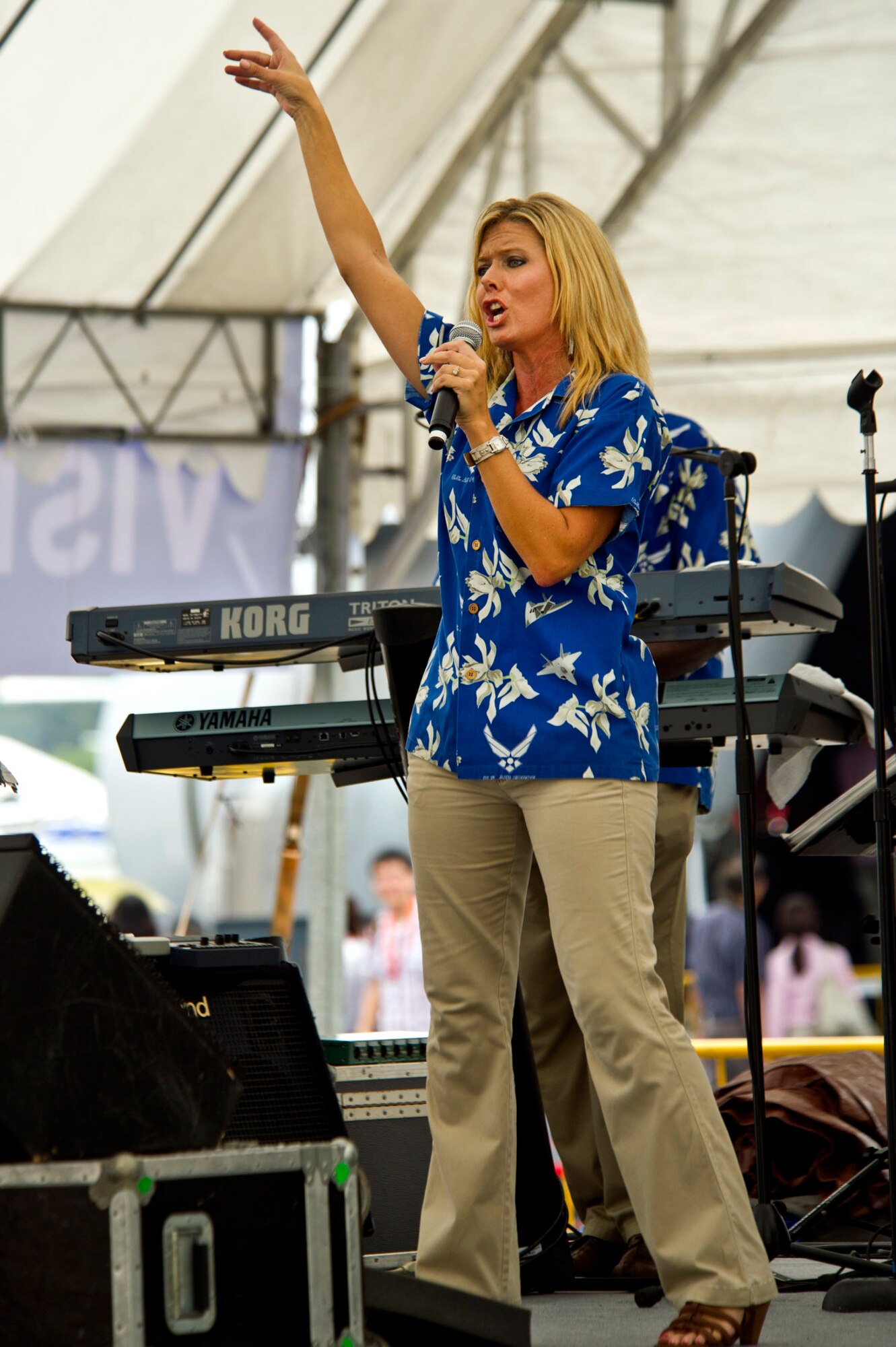 CHANGI, Singapore -- Master Sgt. Lara Murdzin, U.S. Air Force Band of the Pacific, Hawaii performs the Katy Perry hit single "California Girls" on Feb. 17, 2012, at the 2012 Singapore Airshow. The band provided entertainment during the week long Singapore trade and air show performing 13 times. (Department of Defense photo by U.S. Air Force Tech. Sgt. Michael R. Holzworth/Released)