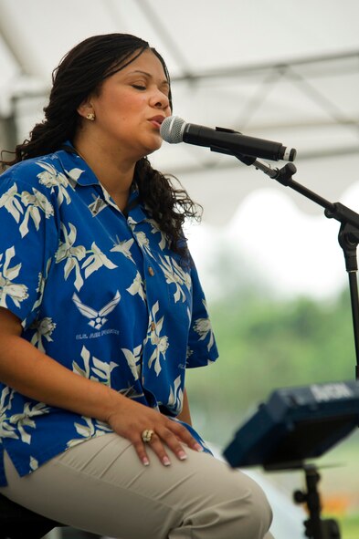 CHANGI, Singapore -- Tech. Sgt. Tamiko Boone, U.S. Air Force Band of the Pacific, Hawaii performs on Feb. 17, 2012, at the 2012 Singapore Airshow. The band provided entertainment during the week long Singapore trade and air show performing 13 times. (Department of Defense photo by U.S. Air Force Tech. Sgt. Michael R. Holzworth/Released)