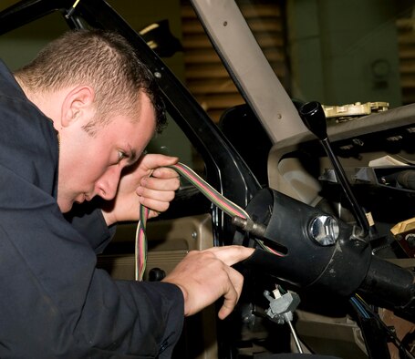 Senior Airman Michael Balkey, 2nd Logistics Readiness Squadron vehicle maintenance, rewires a truck on Barksdale Air Force Base, La., Feb. 21. Balkey replaced a malfunctioning wire in order to make the horn work properly. (U.S. Air Force photo/Airman 1st Class Benjamin Gonsier)(RELEASED)