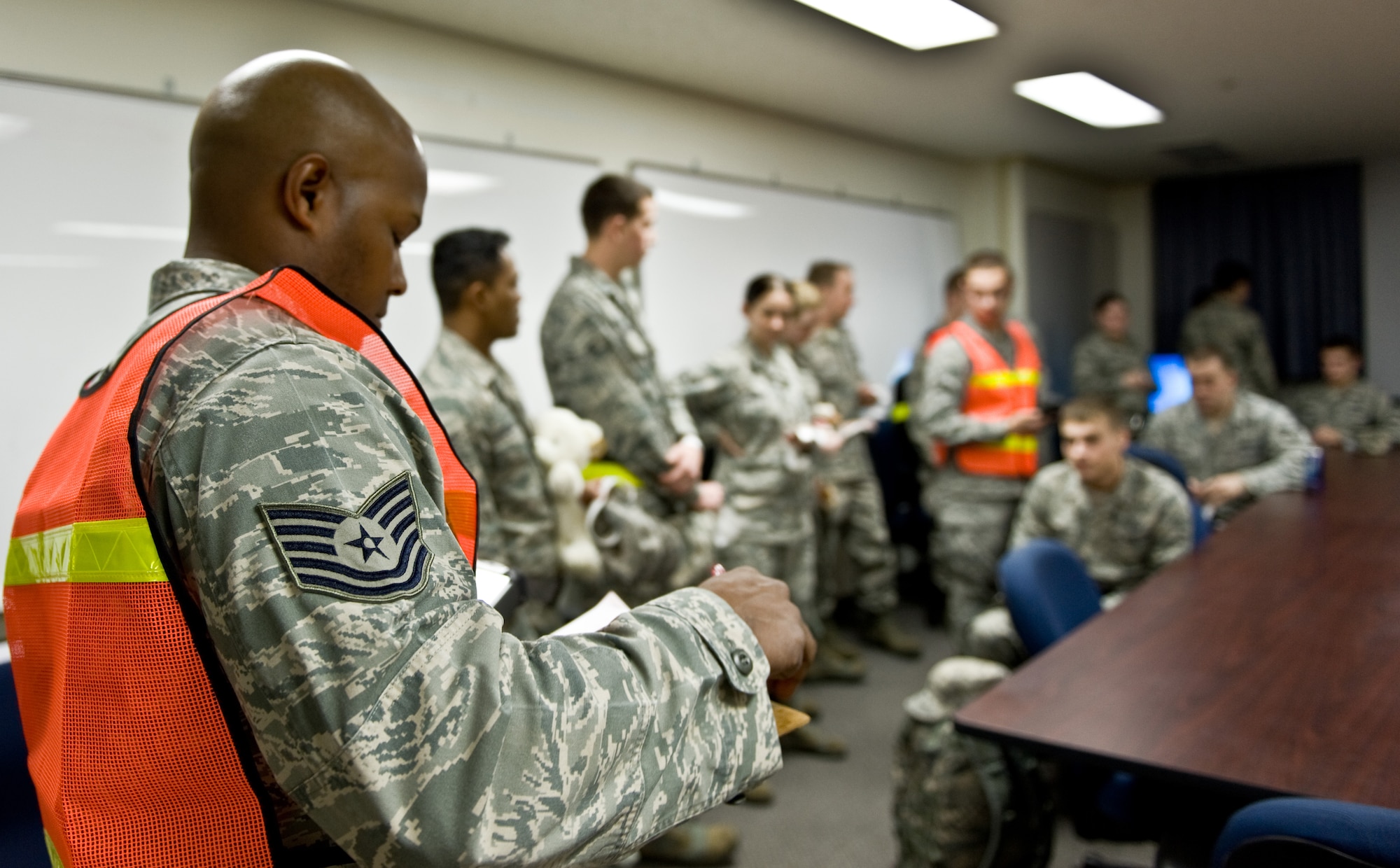YOKOTA AIR BASE, Japan -- Tech. Sgt. Jonathan, 374th Force Support Squadron readiness NCO  in charge, checks a simulated  evacuee list before going to the noncombatant evacuation operations  command and control center during an operational readiness exercise  at Yokota Air Base, Japan, Feb. 21, 2012. Noncombatants are sometimes  evacuated and relocated during times of war, political and civil instability and natural disaster. (U.S. Air Force photo/Airman 1st Class Krystal M. Garrett)