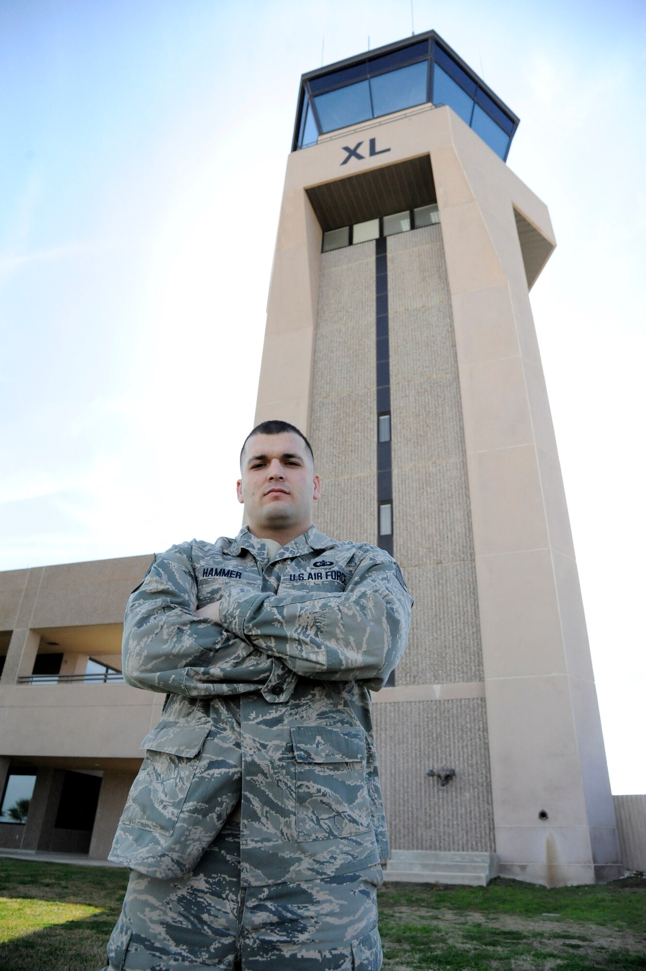 LAUGHLIN AIR FORCE BASE, Texas – Staff Sgt. John Hammer, 47th Operations Support Squadron Radar Approach Control section senior watch supervisor, poses for a photo on the flight line here Feb 15. Hammer and the rest of the air traffic control team control the busiest RAPCON in the Air Force controlling a combined 337,436 operations. (U.S. Air Force photo/Airman 1st Class Nathan L. Maysonet)